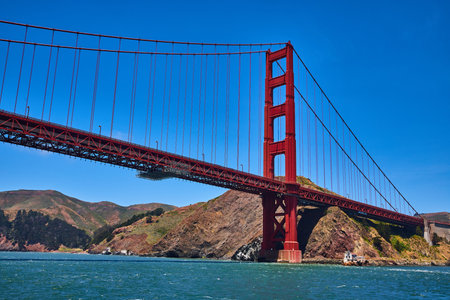 Side view of Golden Gate Bridge with clear blue skies on bright summer dayの写真素材