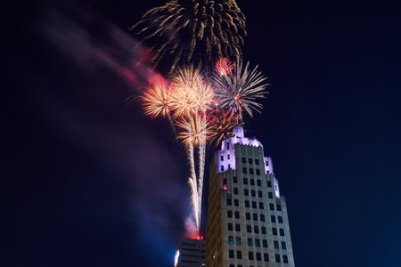 Close up of fireworks launching from Indiana Michigan Power building and purple top of Lincoln Towerの写真素材