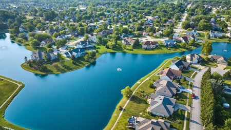 Large pond with rich expensive homes in neighborhood aerialの写真素材