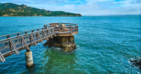 Elephant Rock aerial with coast across bay and blue sky with purple hued cloudsの写真素材