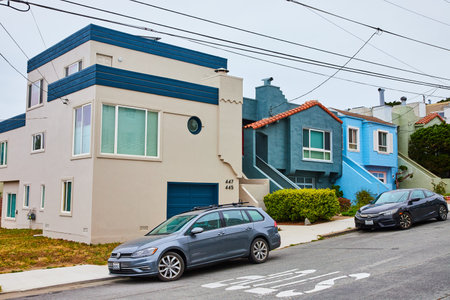 Three houses in California neighborhood with transit wires connecting to buildings