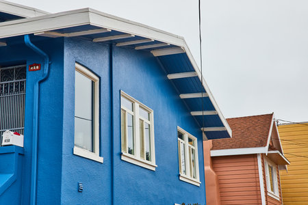 Detail of exterior blue home in white trim of San Francisco, USA on cloudy dayの写真素材