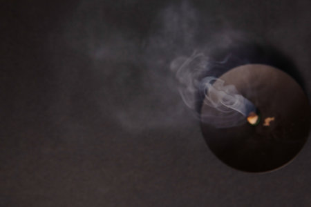 Glowing Wick and Rising Smoke in Tranquil Meditation Sceneの写真素材