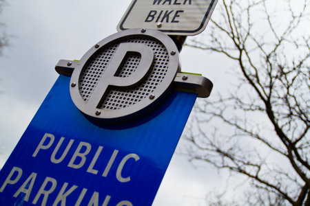 Low-Angle View of Public Parking Sign in Urban Setting