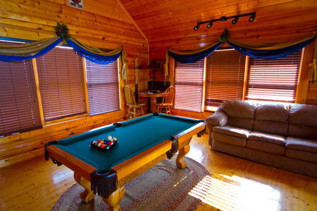 Cozy Rustic Cabin Interior with Pool Table and Leather Sofa in Tennessee