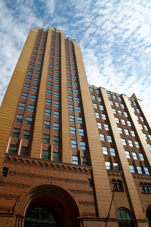Sunlit Brick Skyscraper with Ornate Details in Lansing, Michiganの写真素材