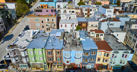Seven colorful and unique apartment buildings in San Francisco neighborhood on sunny day aerial, CAの写真素材