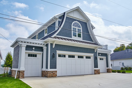 Modern Blue Shingle House with White Trim and Stone Accentsの写真素材