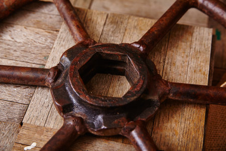 Rusted Industrial Valve on Wooden Texture - Close-Upの写真素材
