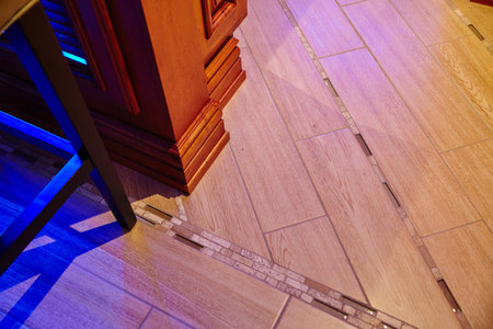 Modern Interior Design with Wooden and Tiled Floor Transitionの写真素材