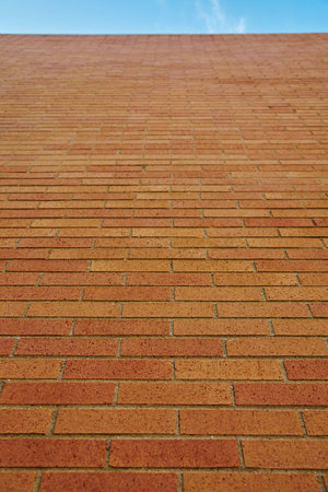 Brick Wall to Clear Blue Sky, Low Angle Viewの写真素材