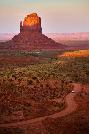 Monument Valley Butte at Sunrise with Winding Roadの写真素材
