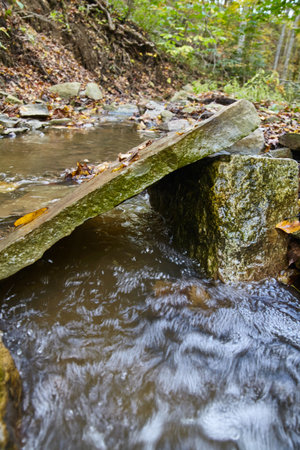 Autumnal Woodland Stream with Stone Bridge, Salamonie River Forestの写真素材