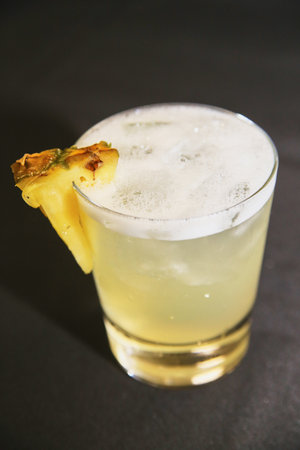 Tropical Pineapple Cocktail with Frothy Top in Short Glass