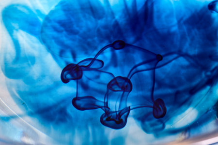 Blue Ink Swirls in Water - Abstract Artistic Background