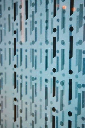 Modern Frosted Glass with Black Geometric Shapes Close-Up