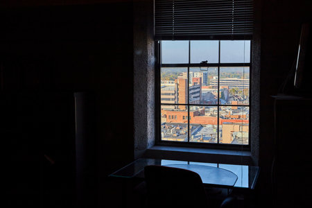 Contemplative Interior and Vibrant Cityscape Contrast