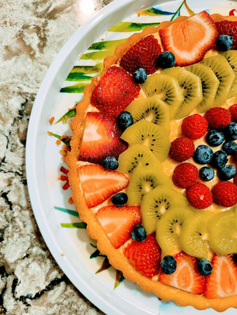 Colorful Fresh Fruit Tart on Marble Countertop - Top Viewの写真素材