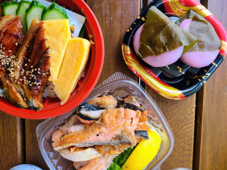 Traditional Japanese Bento Boxes with Salmon and Eelの写真素材