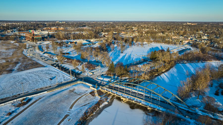 Aerial Golden Hour View of Snowy MLK Bridge and St. Marys River