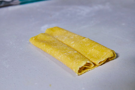Fresh Pasta Dough Preparation - Close-Up in Kitchenの写真素材