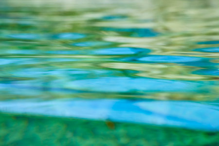 Serene water ripples in vibrant blues and greens, capturing the essence of tranquility at Fort...