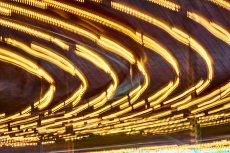 Golden Light Trails in Motion at Night, Abstract Urban Sceneの写真素材
