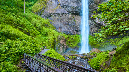 Aerial View of Latourell Falls with Walking Bridge in Lush Forestの写真素材