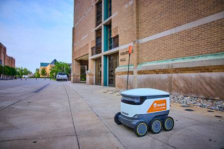 Autonomous Delivery Robot on University Campus Walkway Low-Angle View