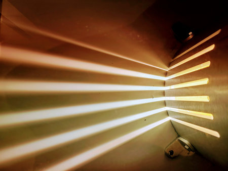 Sunlight Beams Through Industrial Slats Low Perspectiveの写真素材