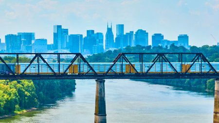 Aerial View of Freight Train on Railway Bridge with Nashville Skylineの写真素材