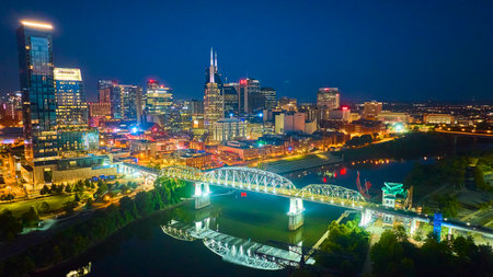 Aerial View Nashville Skyline at Blue Hour with Illuminated Pedestrian Bridgeの写真素材