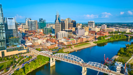 Aerial View of Nashville Skyline with Iconic Bridge and Riverfrontの写真素材