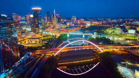 Aerial View Nashville Skyline with Bridges and River at Nightの写真素材
