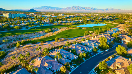 Aerial of Luxurious Suburban Neighborhood and Golf Course at Golden Hourの写真素材