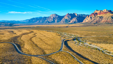 Aerial of Red Rock Canyons Vibrant Cliffs and Desert Roadsの写真素材