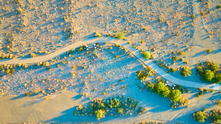 Aerial Desert Pathway and Shrubs Golden Hour Viewの写真素材