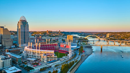 Aerial of Cincinnati Skyline with Ballpark and Roebling Bridge at Sunsetの写真素材