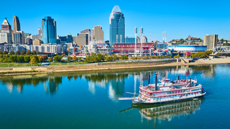 Aerial of Cincinnati Skyline with Riverboat on Ohio Riverの写真素材