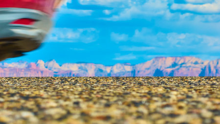 Aerial Motion of Bicycle Wheel with Sunlit Rock Formations in Utahの写真素材