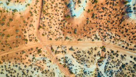 Aerial of Utah Desert Landscape with Dirt Road and Sparse Vegetationの写真素材