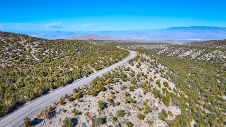 Aerial of Winding Desert Road Through Nevada Mountainsの写真素材