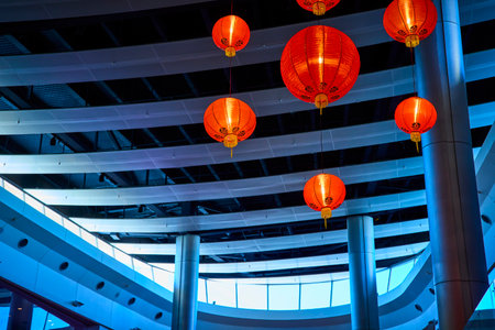 Chinese Lanterns in Modern Architecture During Blue Hour Upward Viewの写真素材
