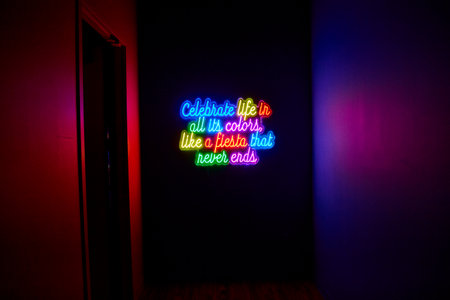 Vibrant Neon Fiesta Sign in Dark Room at Eye Levelの写真素材
