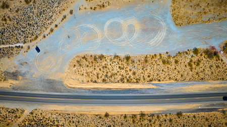 Aerial Desert Road and Tire Marks Motion Overheadの写真素材