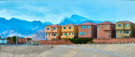 Aerial of Suburban Desert Homes with Mountain Backdrop