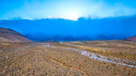 Aerial of Nevada Desert Storm Over Rugged Terrainの写真素材