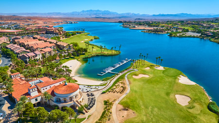 Aerial Luxury Lakeside Resort Golf Course and Marina with Palm Trees Fly Overの写真素材