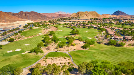 Aerial Golf Course and Luxury Homes in Desert Landscape Fly Over Lake Las Vegasの写真素材
