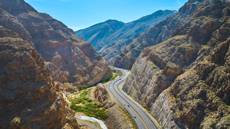 Aerial Motion Over Winding Highway and Canyon Walls in Virgin River Gorge